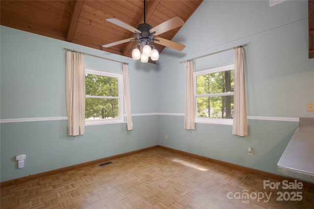 1 Spring Rd, Spruce Pine, NC 28777 - unfurnished room with wooden ceiling, baseboards, a ceiling fan, beam ceiling, and high vaulted ceiling