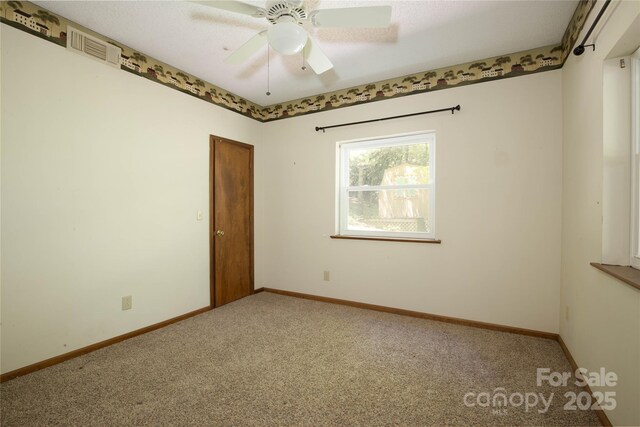1 Spring Rd, Spruce Pine, NC 28777 - carpeted spare room with ceiling fan and baseboards