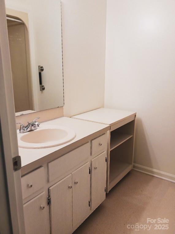617 College Ave SW, Lenoir, NC 28645 - bathroom with vanity and baseboards