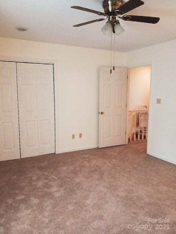 617 College Ave SW, Lenoir, NC 28645 - unfurnished bedroom with carpet flooring, a closet, and a ceiling fan