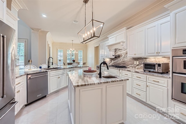 1056 James Madison Dr, Matthews, NC 28104 - kitchen featuring stainless steel appliances, a sink, a chandelier, a peninsula, and recessed lighting