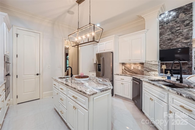 1056 James Madison Dr, Matthews, NC 28104 - kitchen with stainless steel appliances, a chandelier, a sink, a center island with sink, and crown molding