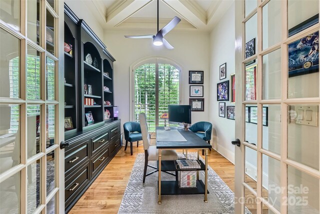 1056 James Madison Dr, Matthews, NC 28104 - home office featuring french doors, coffered ceiling, beamed ceiling, a ceiling fan, and light wood finished floors