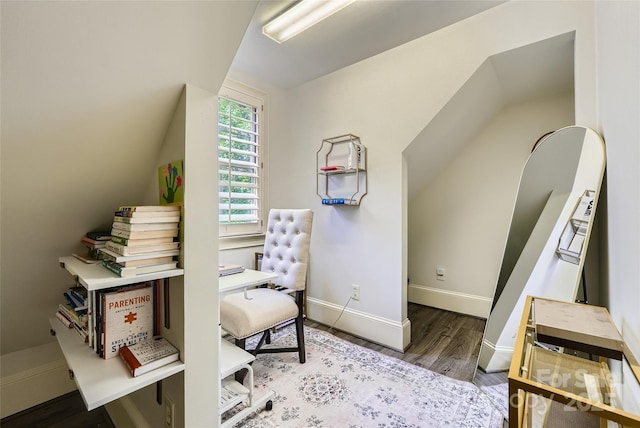 1056 James Madison Dr, Matthews, NC 28104 - sitting room featuring wood finished floors, baseboards, a desk, and vaulted ceiling