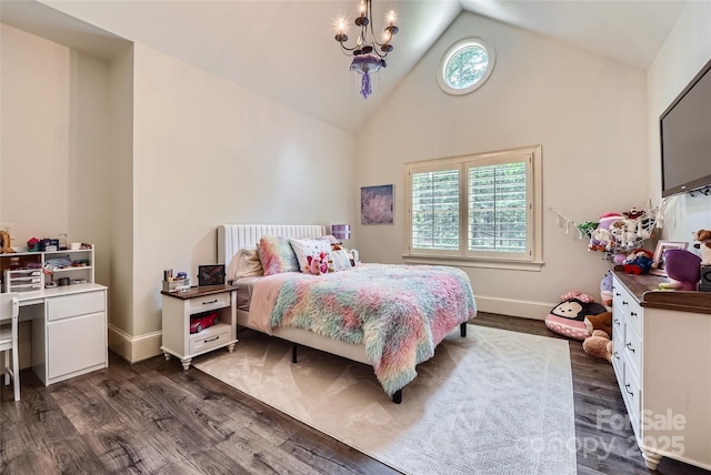1056 James Madison Dr, Matthews, NC 28104 - bedroom with multiple windows, dark wood-type flooring, high vaulted ceiling, a chandelier, and baseboards