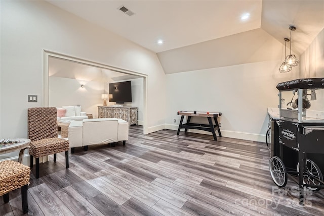 1056 James Madison Dr, Matthews, NC 28104 - sitting room with vaulted ceiling, wood finished floors, recessed lighting, and baseboards