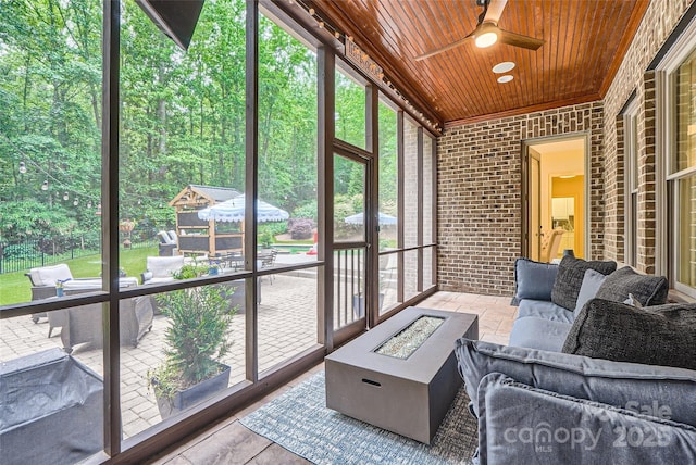 1056 James Madison Dr, Matthews, NC 28104 - sunroom / solarium with a ceiling fan and an outdoor living space with a fire pit