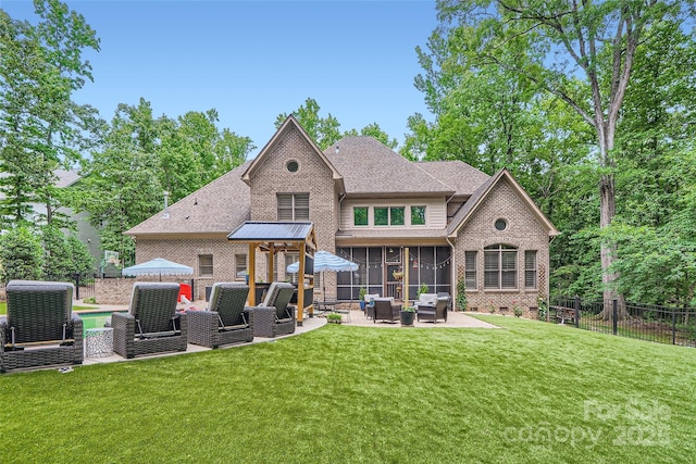 1056 James Madison Dr, Matthews, NC 28104 - back of house featuring outdoor lounge area, brick siding, a sunroom, a patio area, and a shingled roof