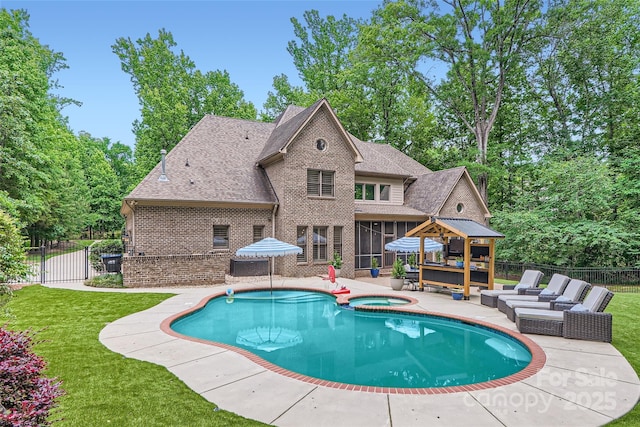 1056 James Madison Dr, Matthews, NC 28104 - view of swimming pool featuring a sunroom, a patio area, an outdoor living space, a pool with connected hot tub, and a gate