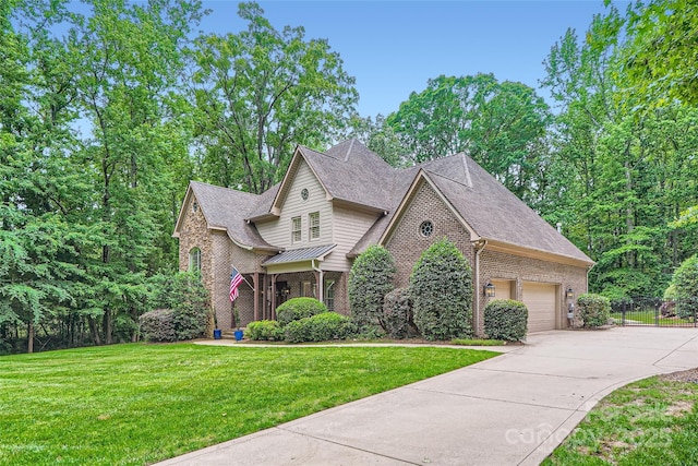 1056 James Madison Dr, Matthews, NC 28104 - traditional-style home with concrete driveway, brick siding, a garage, roof with shingles, and a standing seam roof