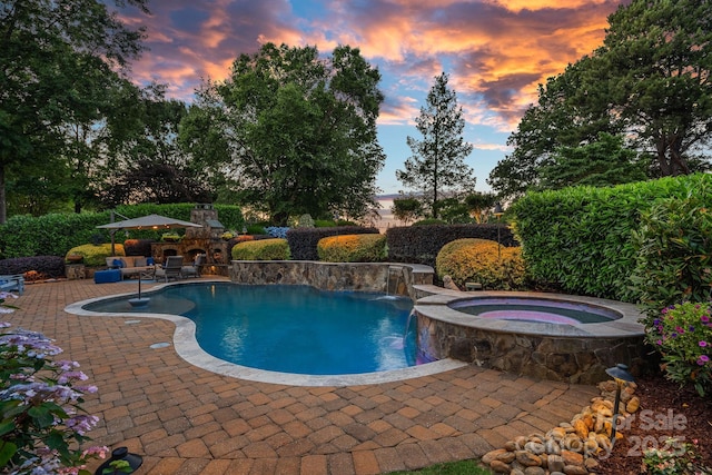 18718 Peninsula Cove Ln, Cornelius, NC 28031 - pool at dusk with a patio area and a pool with connected hot tub