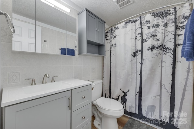3083 Corinth Rd, Gaffney, SC 29340 - bathroom with backsplash, toilet, a textured ceiling, vanity, and curtained shower
