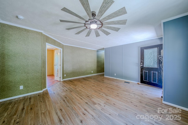 4065 NC-126 Hwy, Morganton, NC 28655 - empty room with wood finished floors, a ceiling fan, ornamental molding, baseboards, and a smoke detector