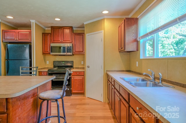 4065 NC-126 Hwy, Morganton, NC 28655 - kitchen with black appliances, a sink, light wood-type flooring, light countertops, and recessed lighting