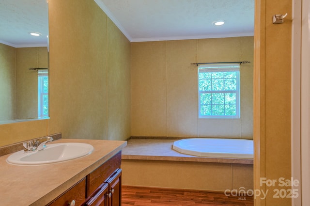4065 NC-126 Hwy, Morganton, NC 28655 - full bathroom featuring plenty of natural light, wood finished floors, vanity, a garden tub, and ornamental molding