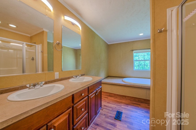 4065 NC-126 Hwy, Morganton, NC 28655 - full bath featuring crown molding, a stall shower, wood finished floors, a bath, and double vanity