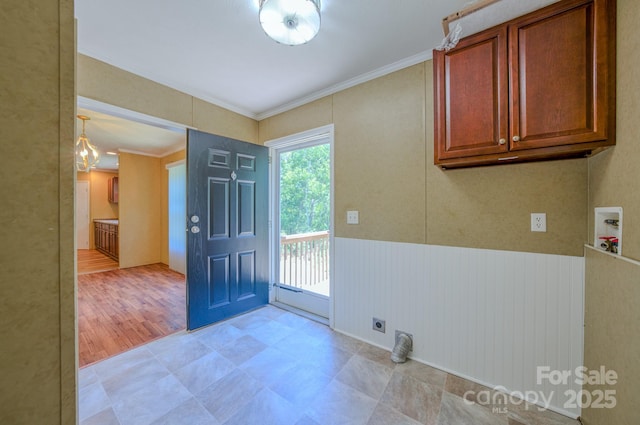 4065 NC-126 Hwy, Morganton, NC 28655 - laundry room featuring cabinet space, washer hookup, hookup for an electric dryer, ornamental molding, and wainscoting