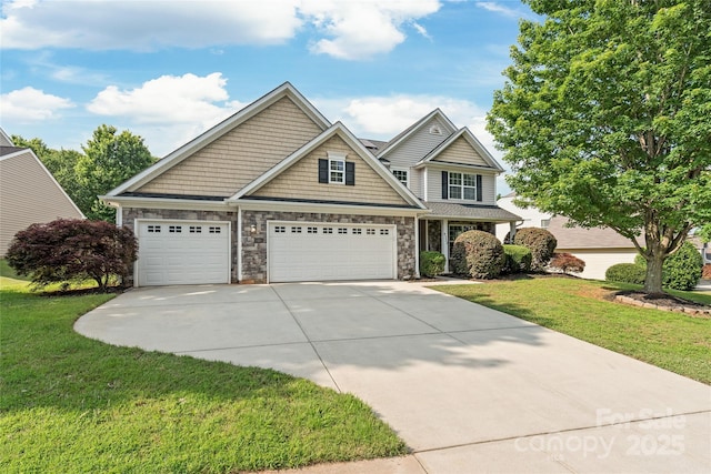 4352 Haddington Dr, Fort Mill, SC 29707 - view of front of house featuring driveway, a front yard, stone siding, and an attached garage