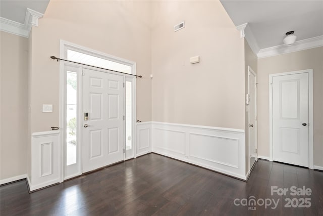 4352 Haddington Dr, Fort Mill, SC 29707 - foyer entrance featuring crown molding, dark wood finished floors, and a wainscoted wall