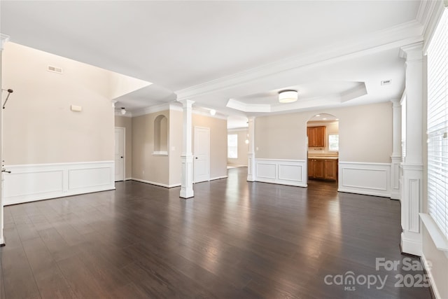 4352 Haddington Dr, Fort Mill, SC 29707 - unfurnished living room with a raised ceiling, a decorative wall, dark wood-style floors, plenty of natural light, and a wainscoted wall