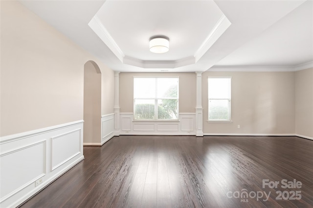 4352 Haddington Dr, Fort Mill, SC 29707 - unfurnished room with a tray ceiling, dark wood finished floors, a wainscoted wall, ornamental molding, and arched walkways