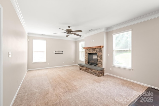 4352 Haddington Dr, Fort Mill, SC 29707 - unfurnished living room featuring crown molding, a ceiling fan, baseboards, a stone fireplace, and carpet