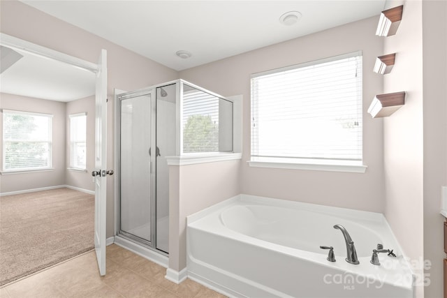4352 Haddington Dr, Fort Mill, SC 29707 - bathroom with a garden tub, a stall shower, and baseboards