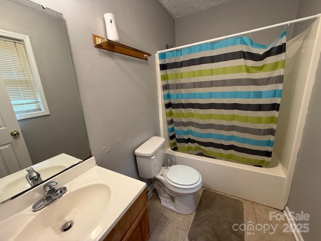 405 Jose St, Shelby, NC 28150 - full bathroom featuring vanity, toilet, shower / bath combo with shower curtain, tile patterned floors, and a textured ceiling