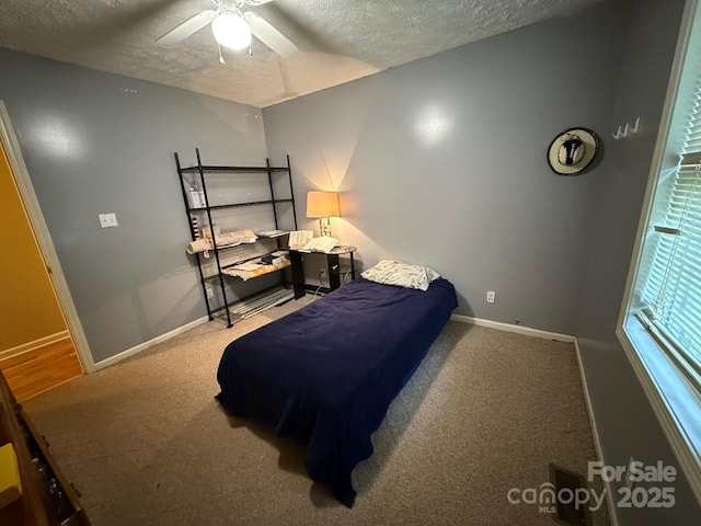 405 Jose St, Shelby, NC 28150 - bedroom featuring a textured ceiling, baseboards, carpet, and ceiling fan