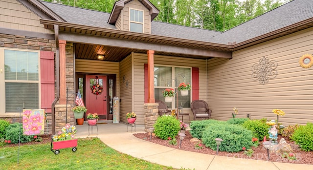 153 Water Leaf Dr, Weaverville, NC 28787 - view of exterior entry featuring a porch, stone siding, and roof with shingles