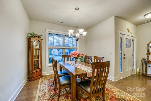 153 Water Leaf Dr, Weaverville, NC 28787 - dining room with a chandelier, wood finished floors, and baseboards
