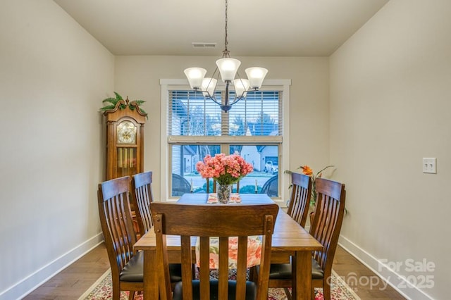 153 Water Leaf Dr, Weaverville, NC 28787 - dining room with a chandelier, baseboards, and wood finished floors