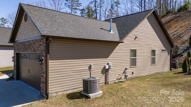 153 Water Leaf Dr, Weaverville, NC 28787 - view of side of property with stone siding, a garage, a lawn, and a shingled roof