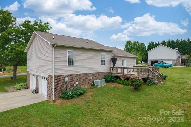 6079 Little River Ct, Granite Falls, NC 28630 - rear view of house with cooling unit, concrete driveway, a deck, a garage, and brick siding