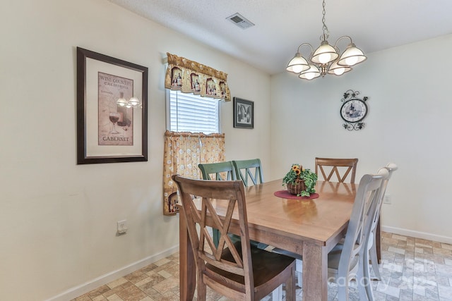 6079 Little River Ct, Granite Falls, NC 28630 - dining area with baseboards, a chandelier, and stone finish floors
