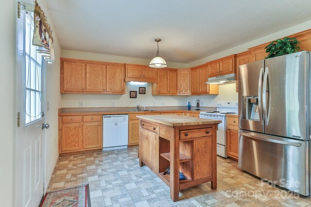 6079 Little River Ct, Granite Falls, NC 28630 - kitchen featuring white appliances, under cabinet range hood, butcher block counters, a sink, and hanging light fixtures