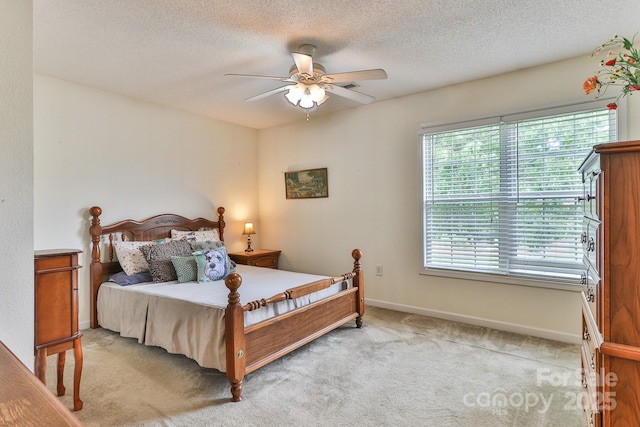 6079 Little River Ct, Granite Falls, NC 28630 - bedroom with light colored carpet, a textured ceiling, baseboards, and ceiling fan