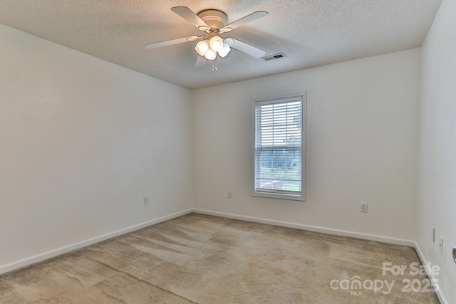 6079 Little River Ct, Granite Falls, NC 28630 - empty room featuring a textured ceiling, light colored carpet, a ceiling fan, and baseboards