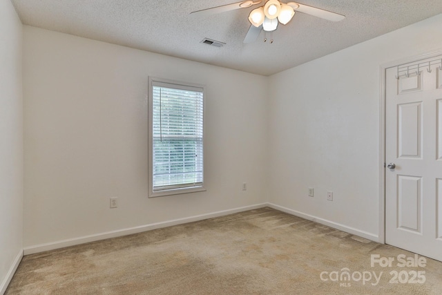 6079 Little River Ct, Granite Falls, NC 28630 - empty room with light carpet, ceiling fan, baseboards, and a textured ceiling