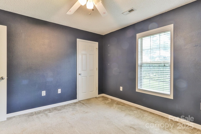6079 Little River Ct, Granite Falls, NC 28630 - carpeted empty room with ceiling fan, baseboards, and a textured ceiling