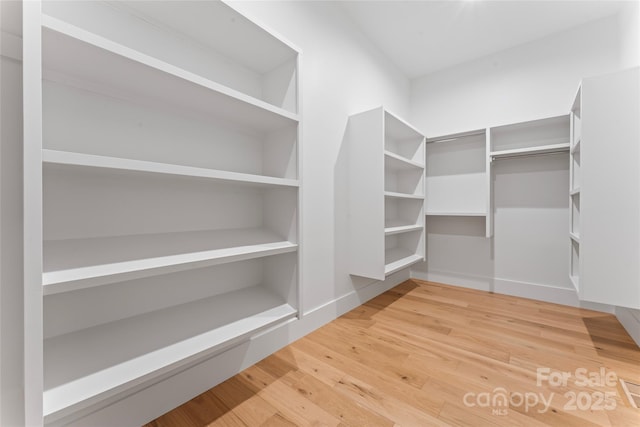 3078 Mountain Creek Dr, Sherrills Ford, NC 28673 - walk in closet featuring wood finished floors