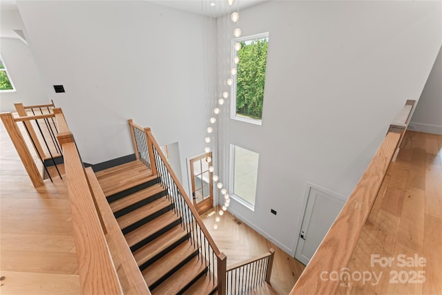 3078 Mountain Creek Dr, Sherrills Ford, NC 28673 - staircase featuring plenty of natural light, baseboards, and wood finished floors