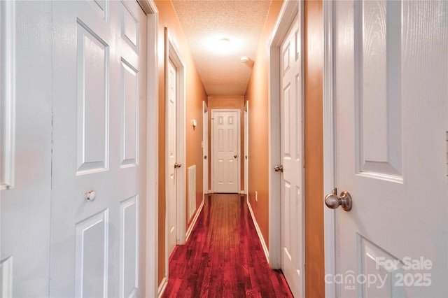 1170 Scenic Dr, Shelby, NC 28150 - corridor featuring dark wood-style flooring, a textured ceiling, and baseboards