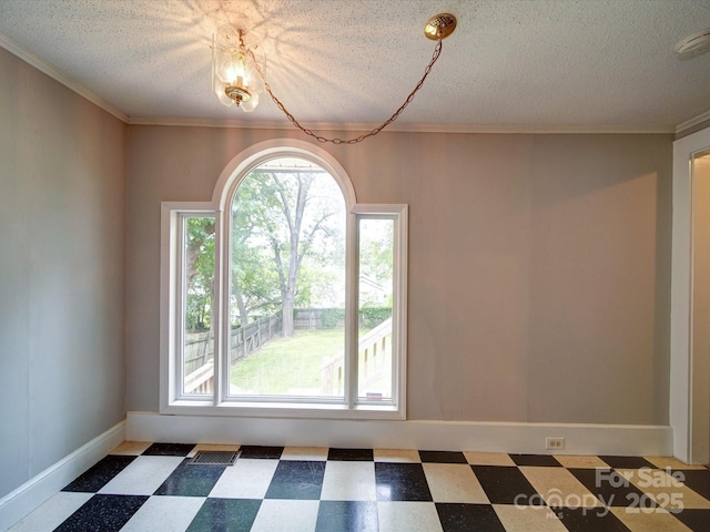 318 Chestnut Ave, Kannapolis, NC 28081 - unfurnished room with tile patterned floors, a textured ceiling, crown molding, baseboards, and a smoke detector