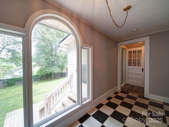 318 Chestnut Ave, Kannapolis, NC 28081 - unfurnished dining area featuring dark floors, crown molding, baseboards, and a textured ceiling