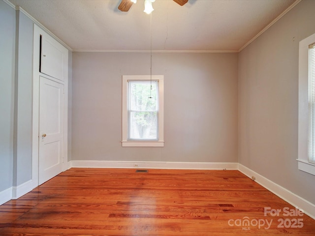 318 Chestnut Ave, Kannapolis, NC 28081 - empty room with crown molding, light wood-type flooring, ceiling fan, and baseboards
