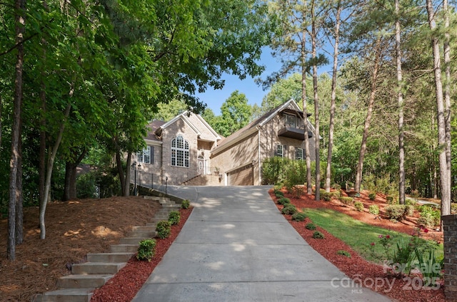 171 Secretariat Dr, Mooresville, NC 28117 - view of front facade featuring driveway, a garage, and stairway