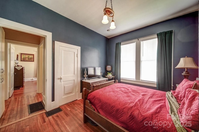 401 7th St, Spencer, NC 28159 - bedroom featuring wood finished floors and baseboards