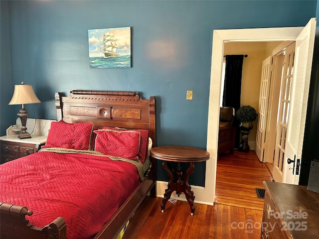 401 7th St, Spencer, NC 28159 - bedroom featuring wood finished floors and baseboards