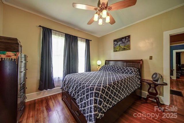 401 7th St, Spencer, NC 28159 - bedroom featuring baseboards, dark wood-type flooring, ornamental molding, and ceiling fan